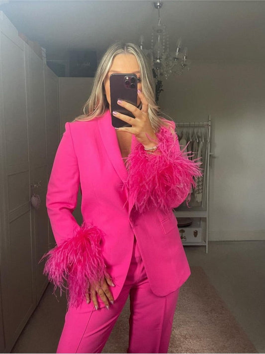 Pink suit with feathers